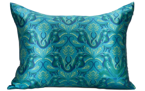 A silk pillowcase laid on a clean towel before the hand wash rinse step