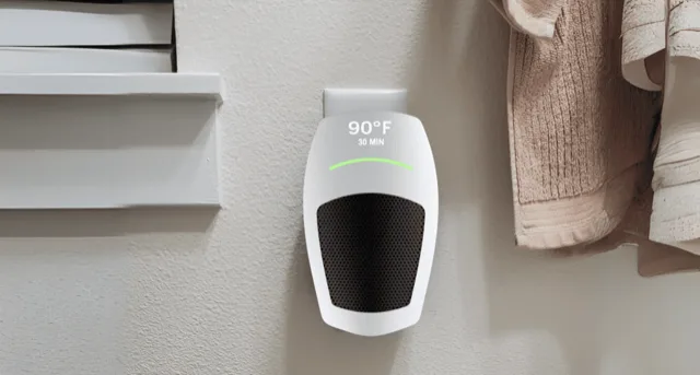 Cyber Heater plugged into a wall outlet showing the LED temperature display