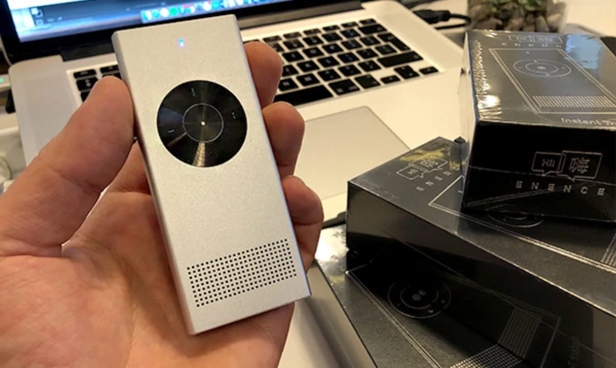 Enence instant translator handheld device with its two-button interface for two-way travel translation