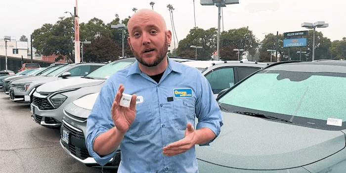 FIXD OBD2 sensor plugged into a car's diagnostic port under the dashboard