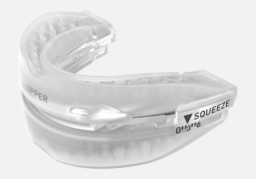 SnoreRX boil-and-bite fitting process showing mouthpiece being molded