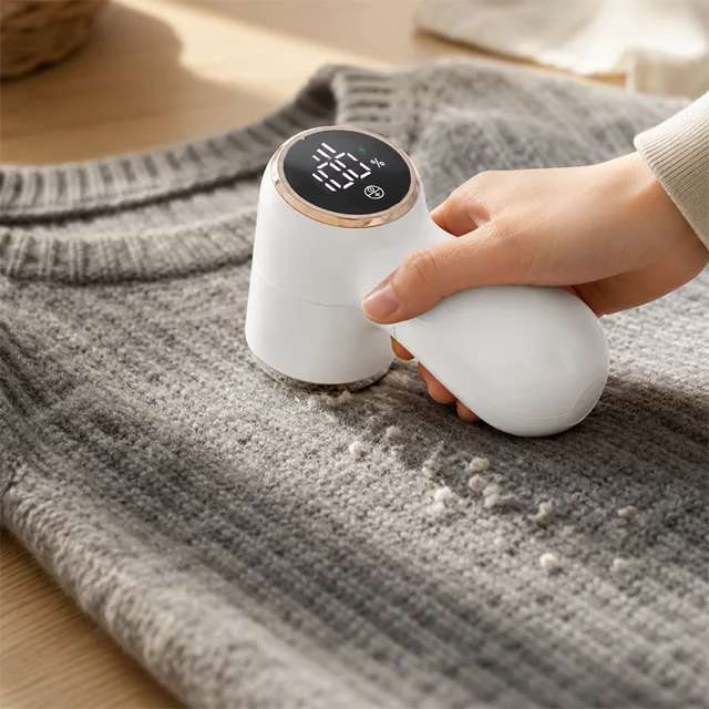 A wool sweater with pills clustering on the cuffs and sides