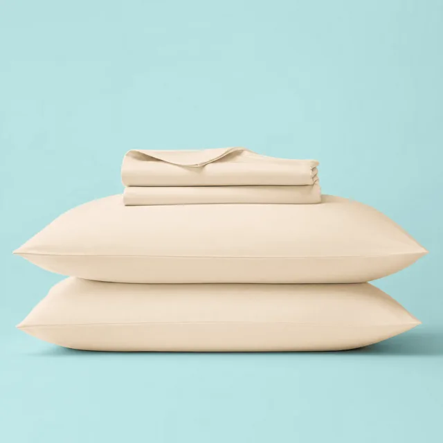 The Sleepgram sheet set in the soft Oat color option for neutral bedroom styling