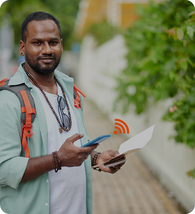 Traveler using Solis portable WiFi hotspot at the airport